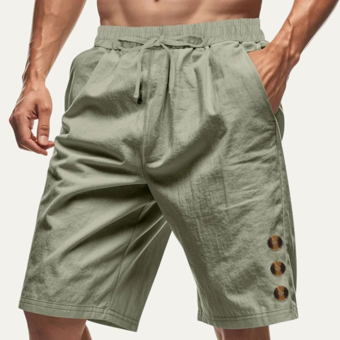 Olive green men casual shorts with drawstring waist and side button detail on model