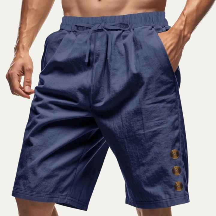 Navy blue casual drawstring shorts with button detail and side pockets on model