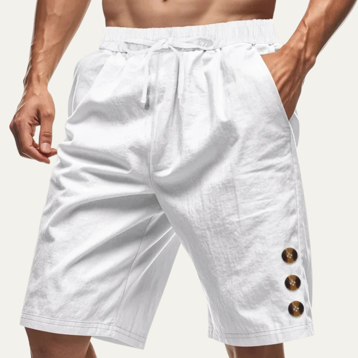 White men casual drawstring shorts with button detail and relaxed summer fit on model