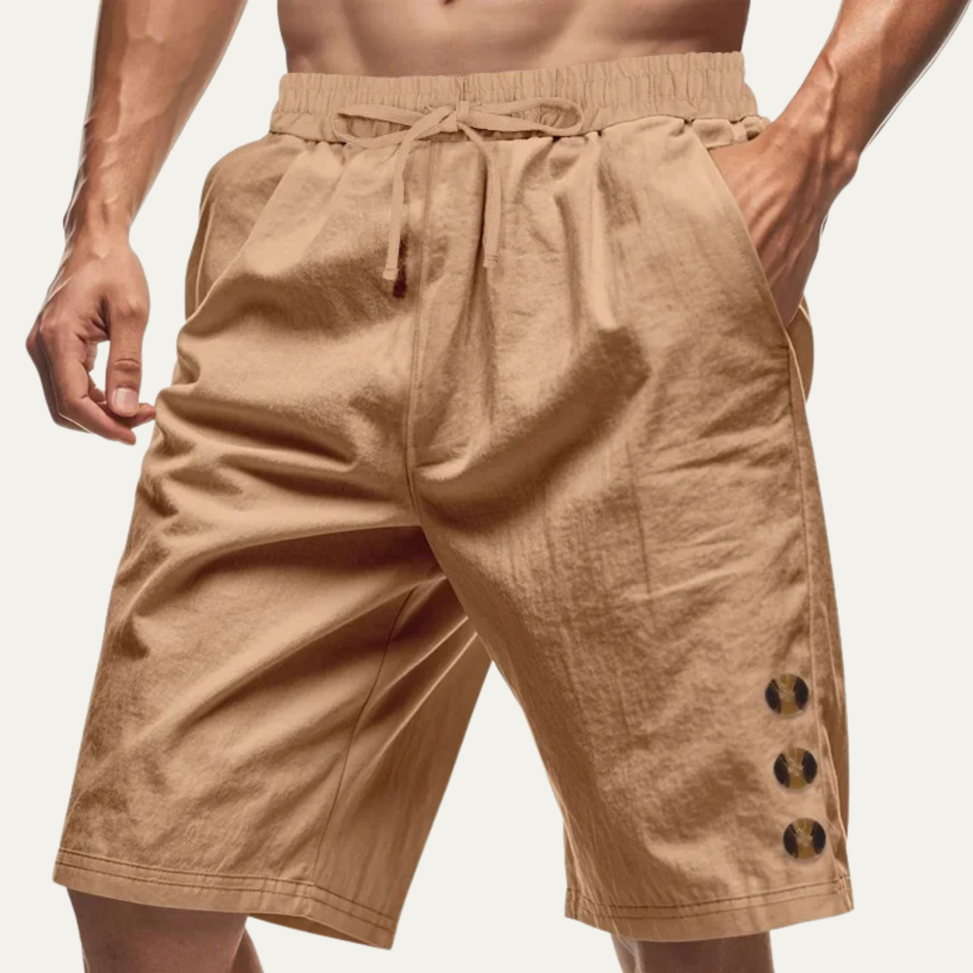 Tan casual drawstring shorts with button detail, front view on model