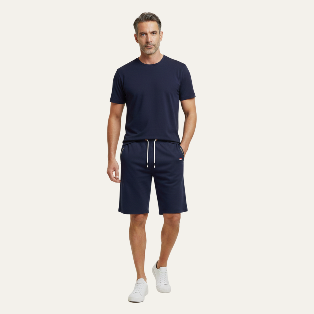 Model wearing navy blue casual jogger shorts with drawstring waist and pockets