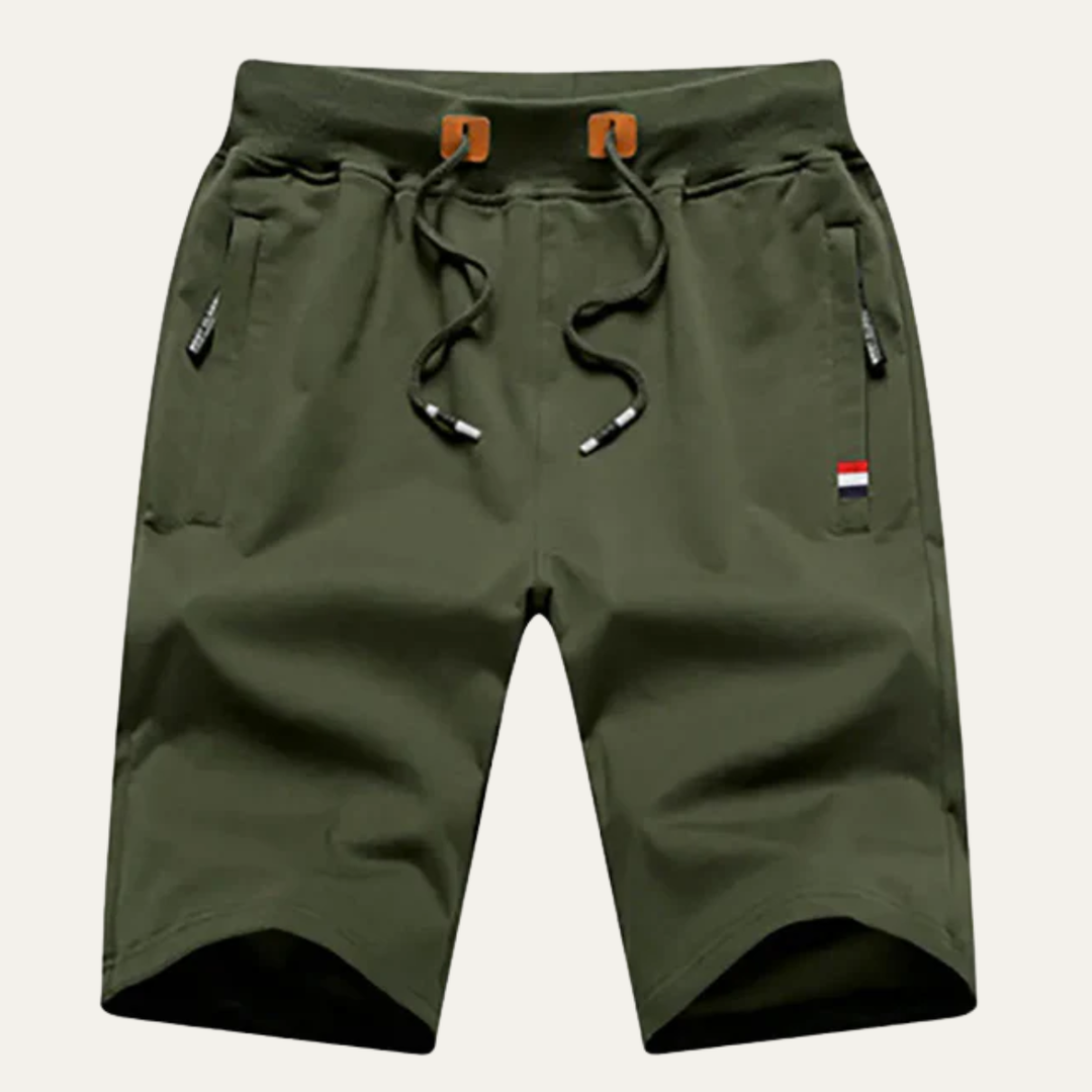 Olive green men casual jogger shorts with drawstring waist, pockets, and logo tag