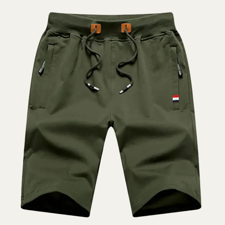 Olive green men casual jogger shorts with drawstring waist, pockets, and logo tag