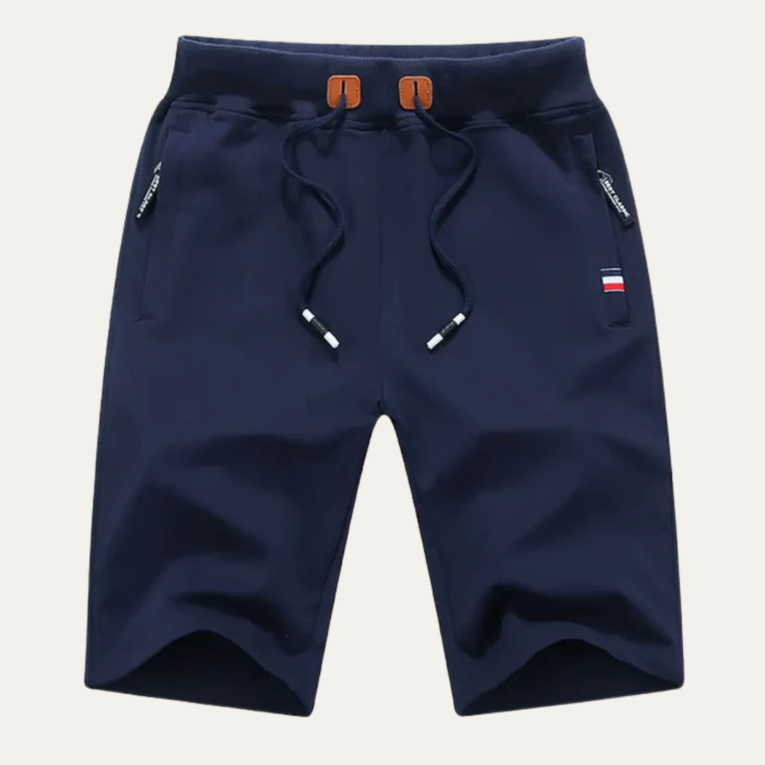 Navy blue men casual jogger shorts with drawstring, zip pockets, and straight hem