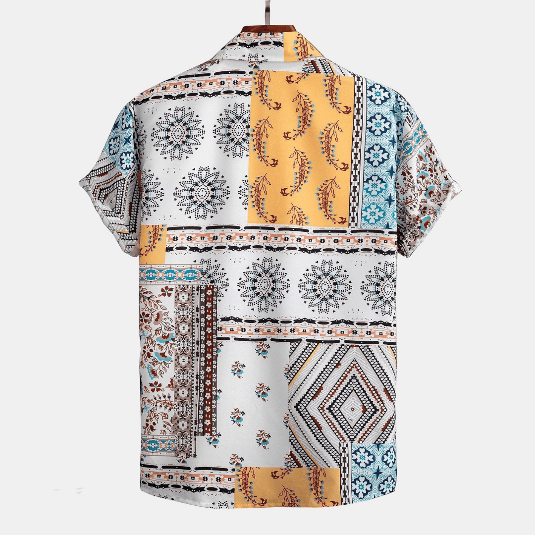 Back view of men patchwork shirt showing multicolor patterned short sleeve design and relaxed fit