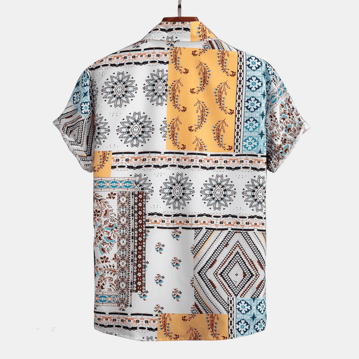 Back view of men patchwork shirt showing multicolor patterned short sleeve design and relaxed fit