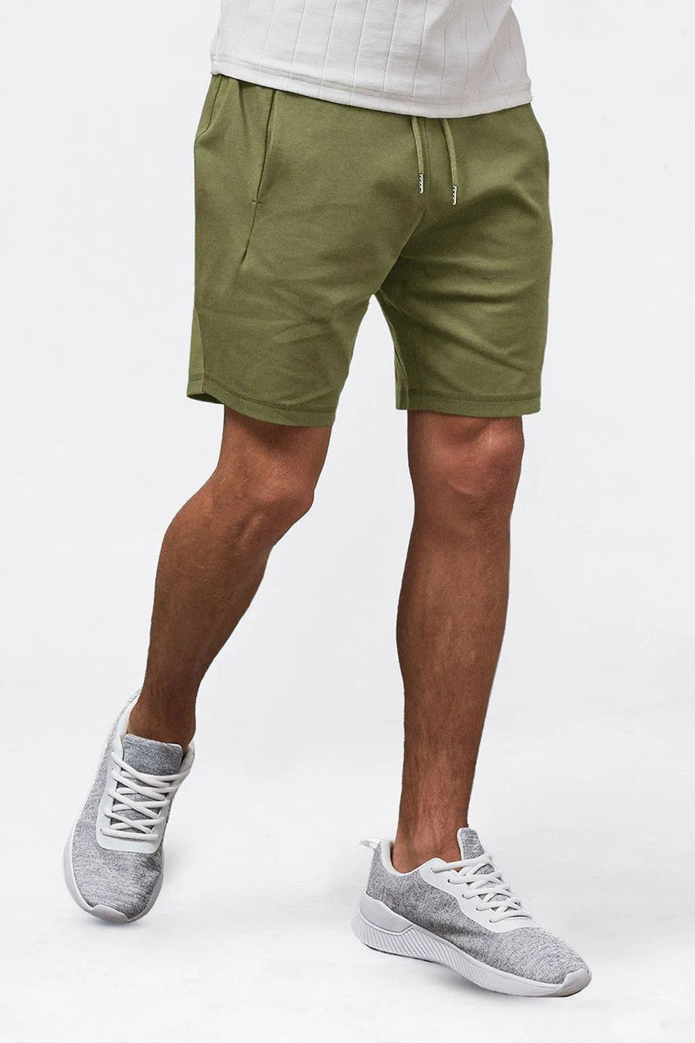 Olive green men casual summer drawstring shorts shown on model with relaxed fit and side pocket
