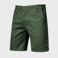Olive green men casual tailored shorts with pockets, button waist and rolled hem front view