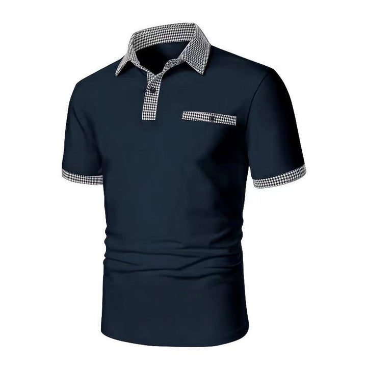 Navy blue men's polo shirt with checkered trim on collar, sleeves, and pocket