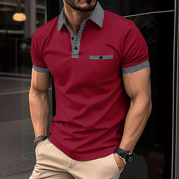 Red men's polo shirt with checkered collar, chest pocket trim, and matching sleeve accents