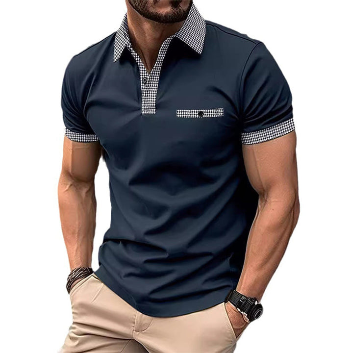 Navy short sleeve polo shirt with checkered collar, placket, and sleeve trim on a male model