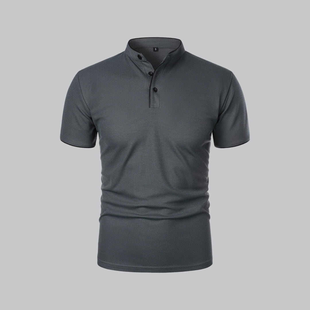 Three-quarter front view of light beige polo shirt with stand collar and black-trimmed neckline