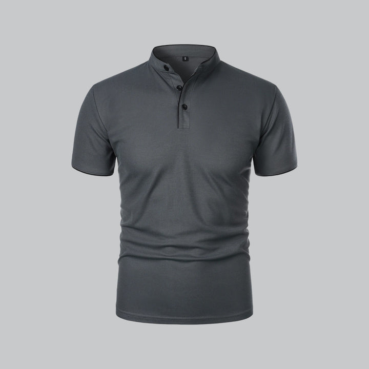 Three-quarter front view of light beige polo shirt with stand collar and black-trimmed neckline