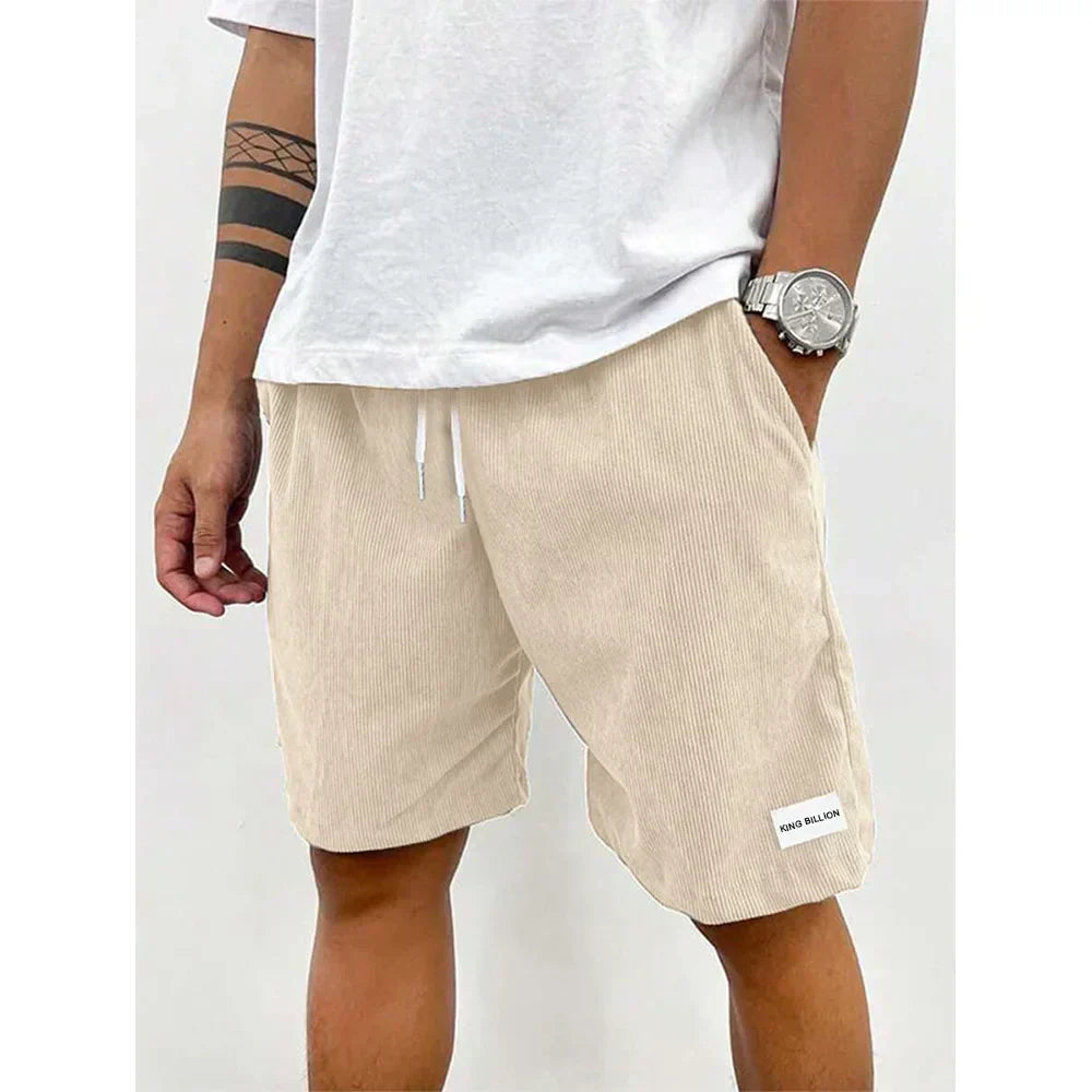 Light tan corduroy knee length shorts for men with white drawstring waist and relaxed fit