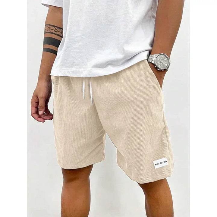 Light tan corduroy knee length shorts for men with white drawstring waist and relaxed fit