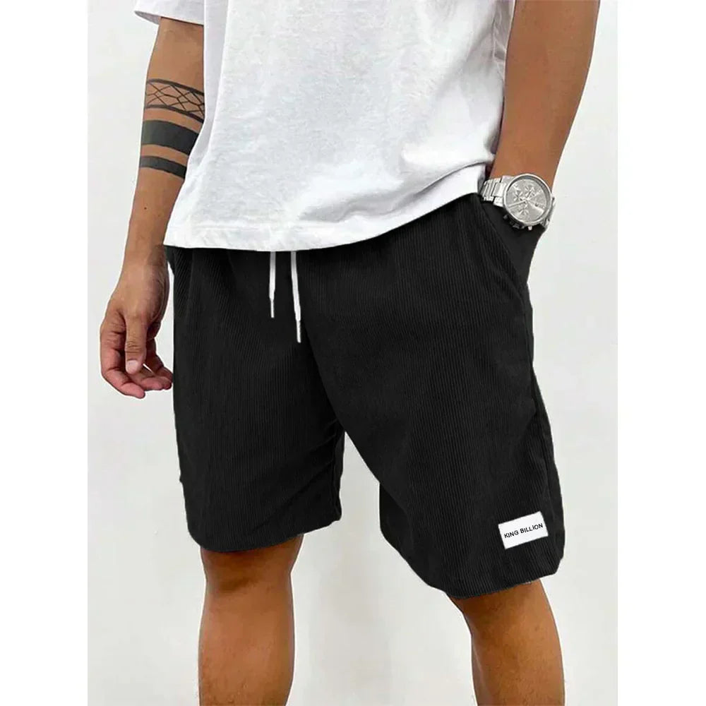 Black mens corduroy drawstring knee length shorts with ribbed fabric and side pocket opening