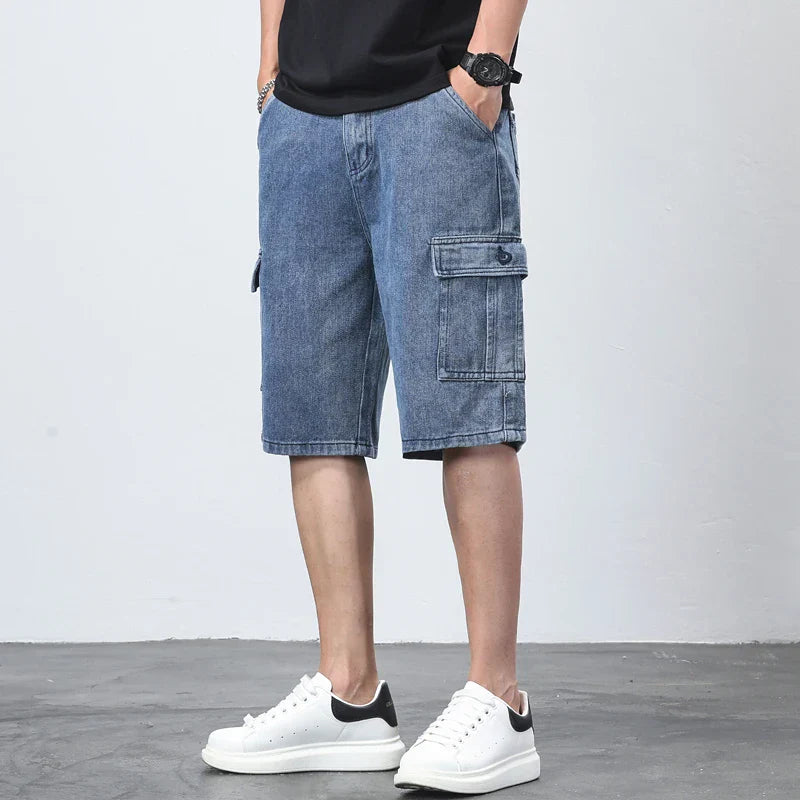 Front view of blue denim cargo shorts for men with relaxed fit and large side pocket