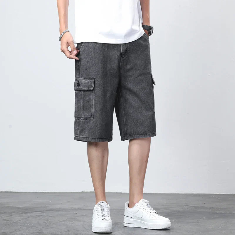 Dark wash denim cargo knee length shorts with flap pocket and casual streetwear styling