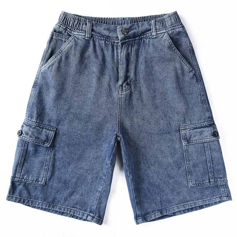Flat lay of dark gray denim cargo shorts with elastic waist and multiple utility pockets