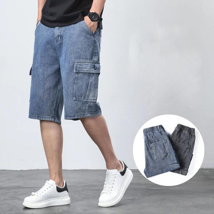 Back view of charcoal denim cargo shorts with relaxed knee length fit and side pockets