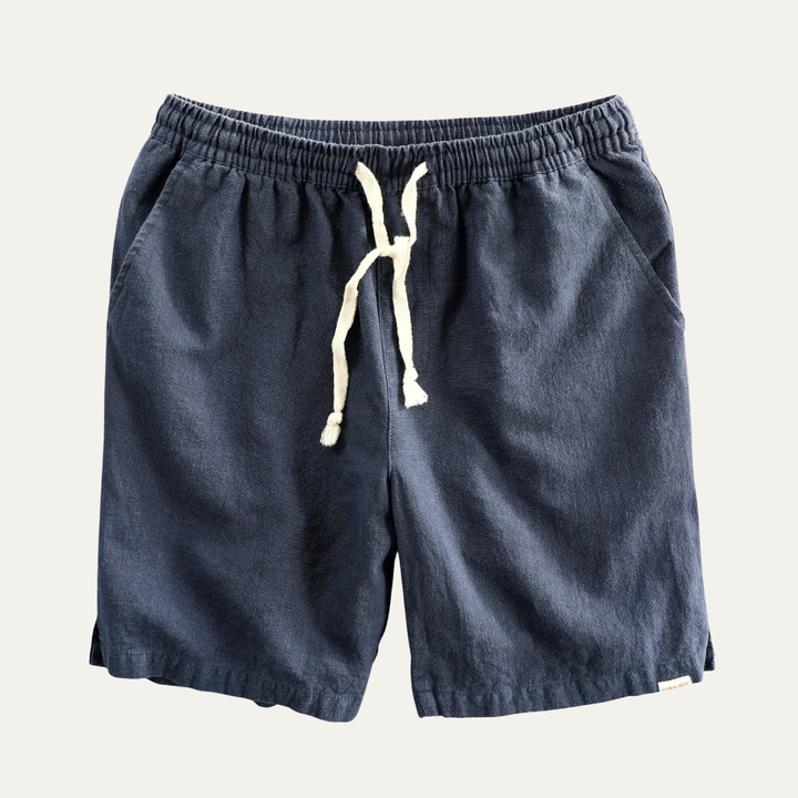 Navy linen beach shorts with drawstring and relaxed straight leg, flat lay