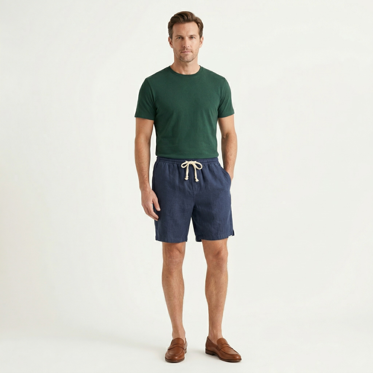 Men linen beach shorts in navy styled with green t shirt and brown loafers