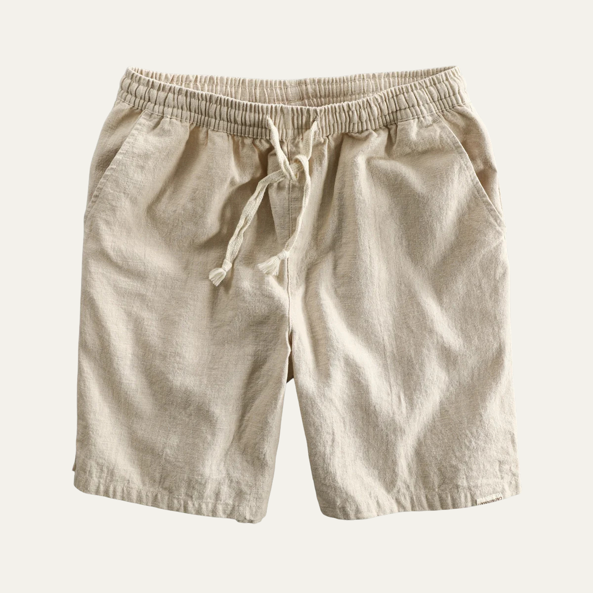 Beige linen beach shorts with drawstring waist, front flat lay product shot