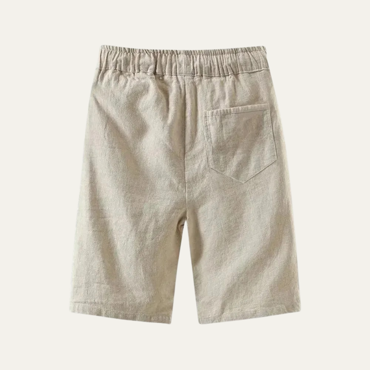 Back view of beige linen knee length shorts with elastic waist and patch pocket