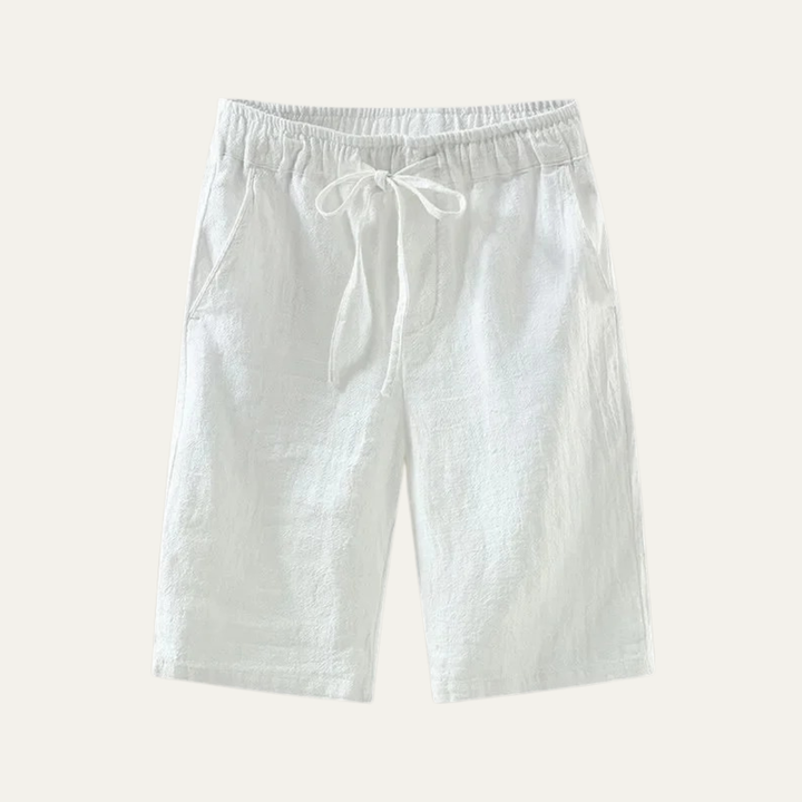 White linen knee length shorts with drawstring waist and relaxed fit