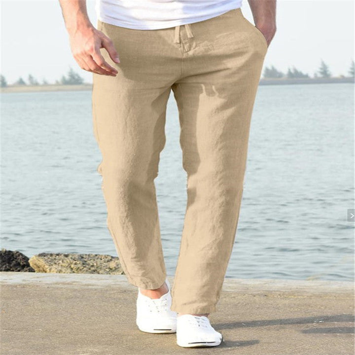 Khaki men's linen pants showing relaxed straight leg design and lightweight summer slacks
