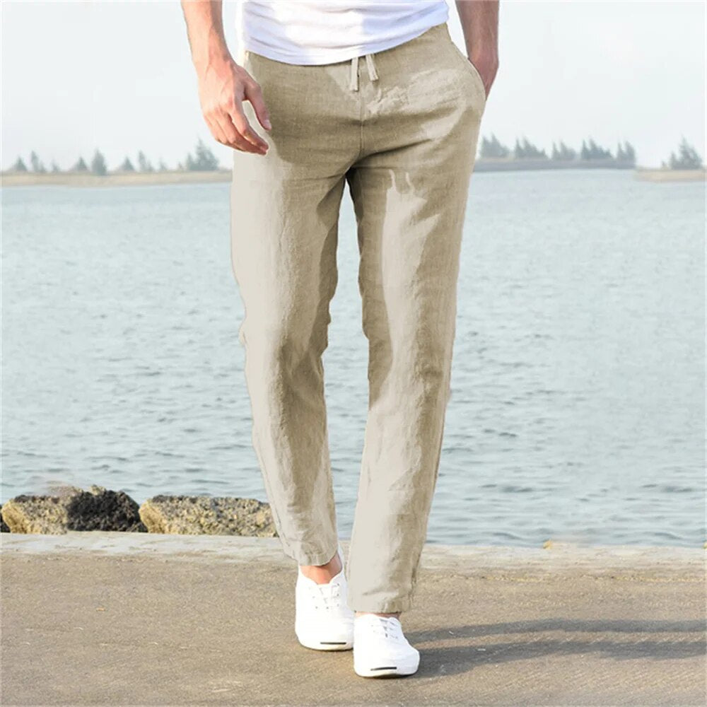 Beige men's linen pants with relaxed straight leg fit and drawstring waist