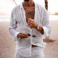 White men's linen shirt long sleeve button up, open collar beach style with white pants