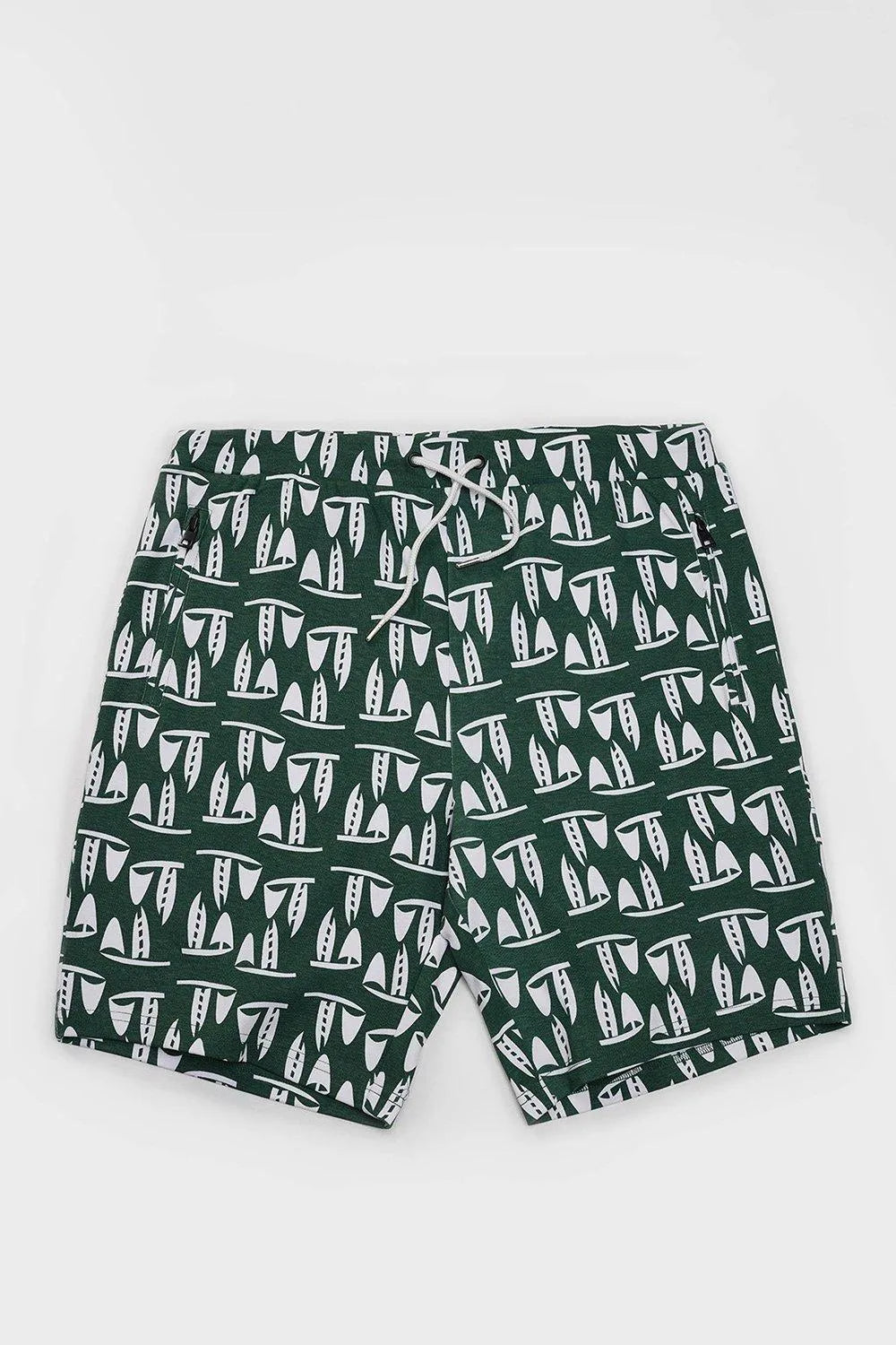 Green sailboat print mens drawstring shorts with zipper pockets, flat lay on white