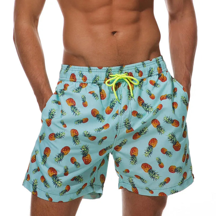 Light blue pineapple print swim shorts for men with pockets and neon drawstring waist