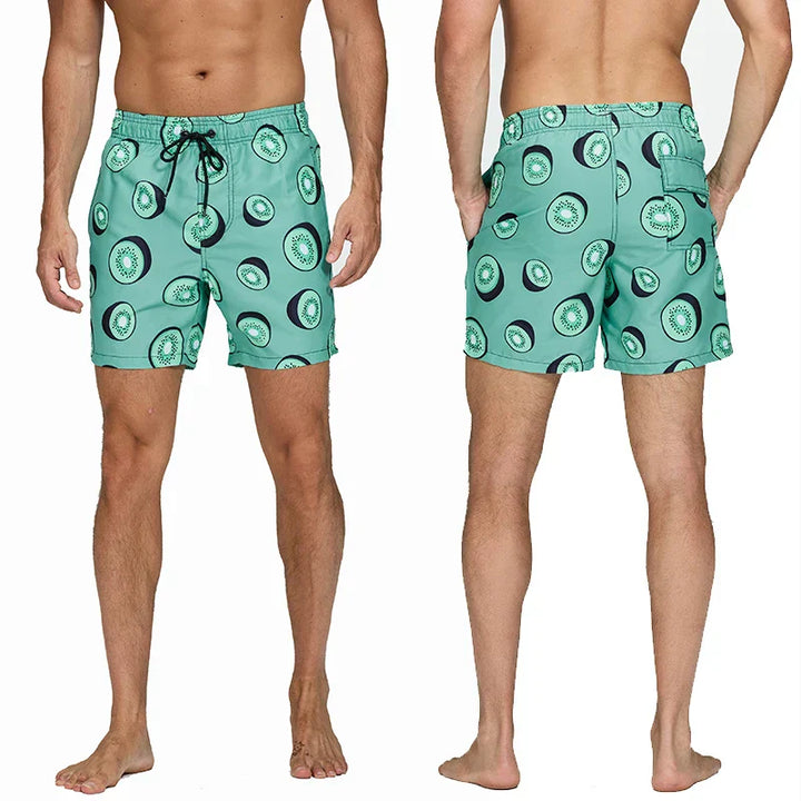 Mint green kiwi print swim shorts front and back view with drawstring waist and pockets
