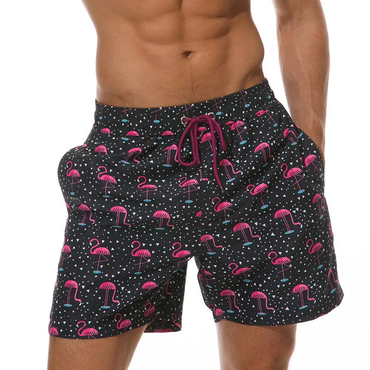 Black flamingo print swim shorts with side pockets and burgundy drawstring waist detail