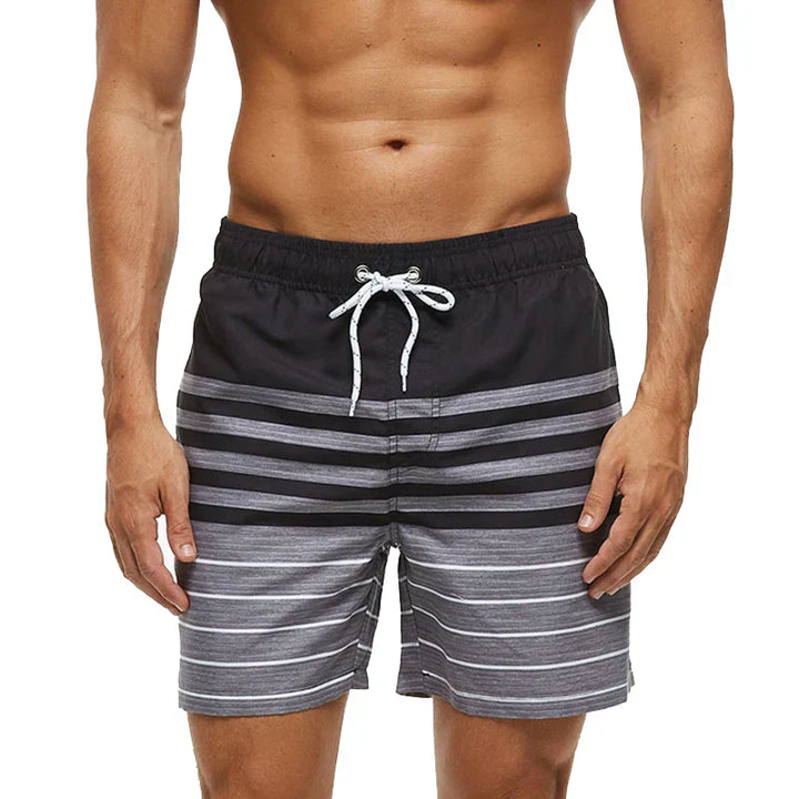 Black and gray striped swim shorts with pockets and white drawstring waist, front view