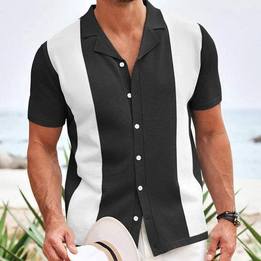 Black short sleeve polo shirt with white contrast panels and button front