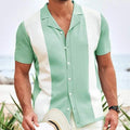 Mint green short sleeve polo shirt with white contrast panels and button front