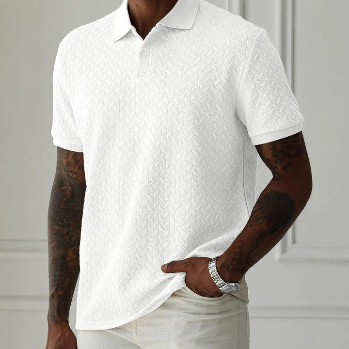 White short sleeve textured knit polo shirt with crisp collar and allover chevron texture