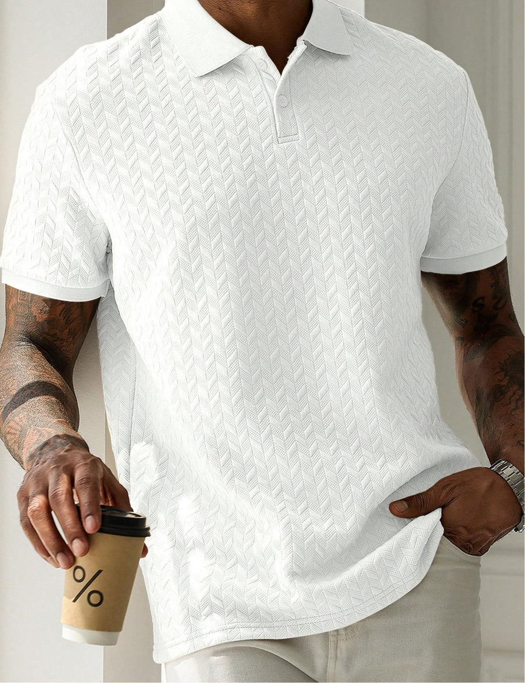 White short sleeve textured knit polo shirt close-up with chevron knit detail and soft drape