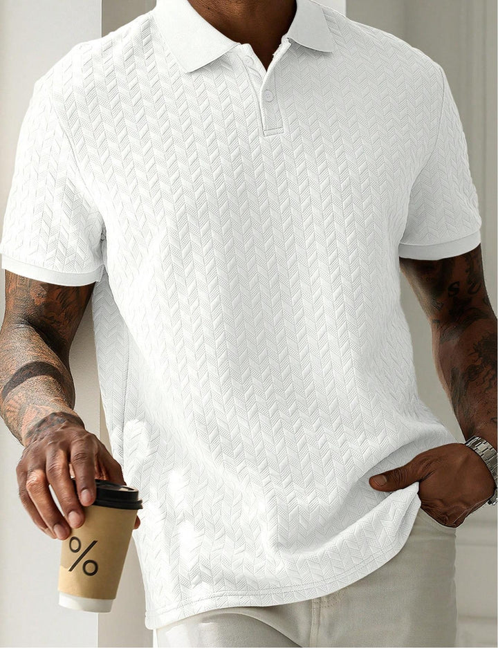 White short sleeve textured knit polo shirt close-up with chevron knit detail and soft drape