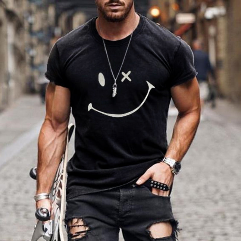 Black smiley graphic crew neck t shirt shown with blurred street background