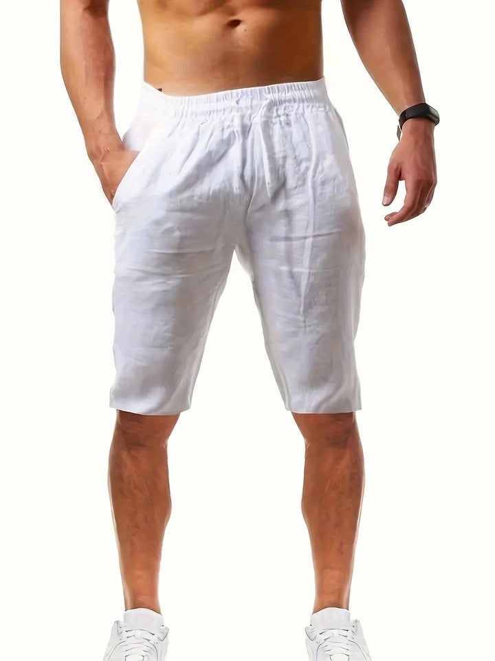 White knee length shorts for men with relaxed fit, elastic waistband and side pockets