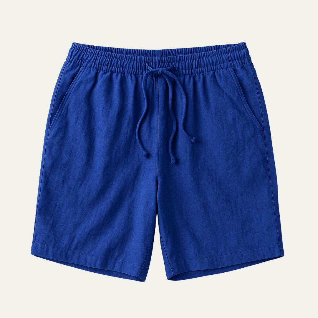 Bright blue cotton beach shorts with elastic waist and relaxed fit