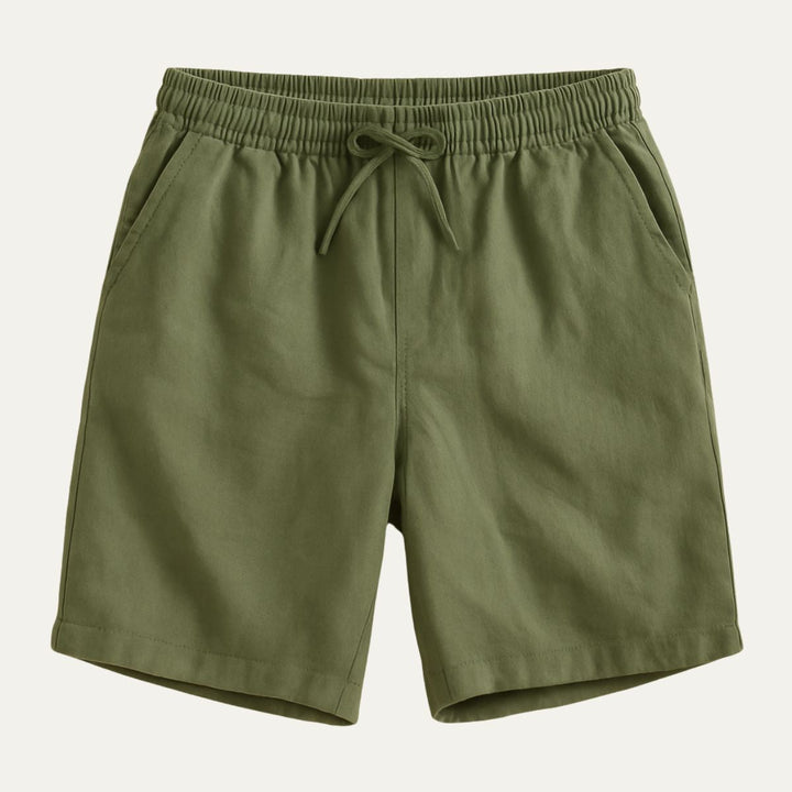 Olive green cotton beach shorts with elastic waist, drawstring, and side pockets