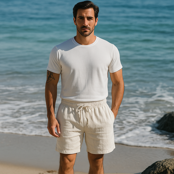Men wearing cream summer shorts with white t shirt at the beach