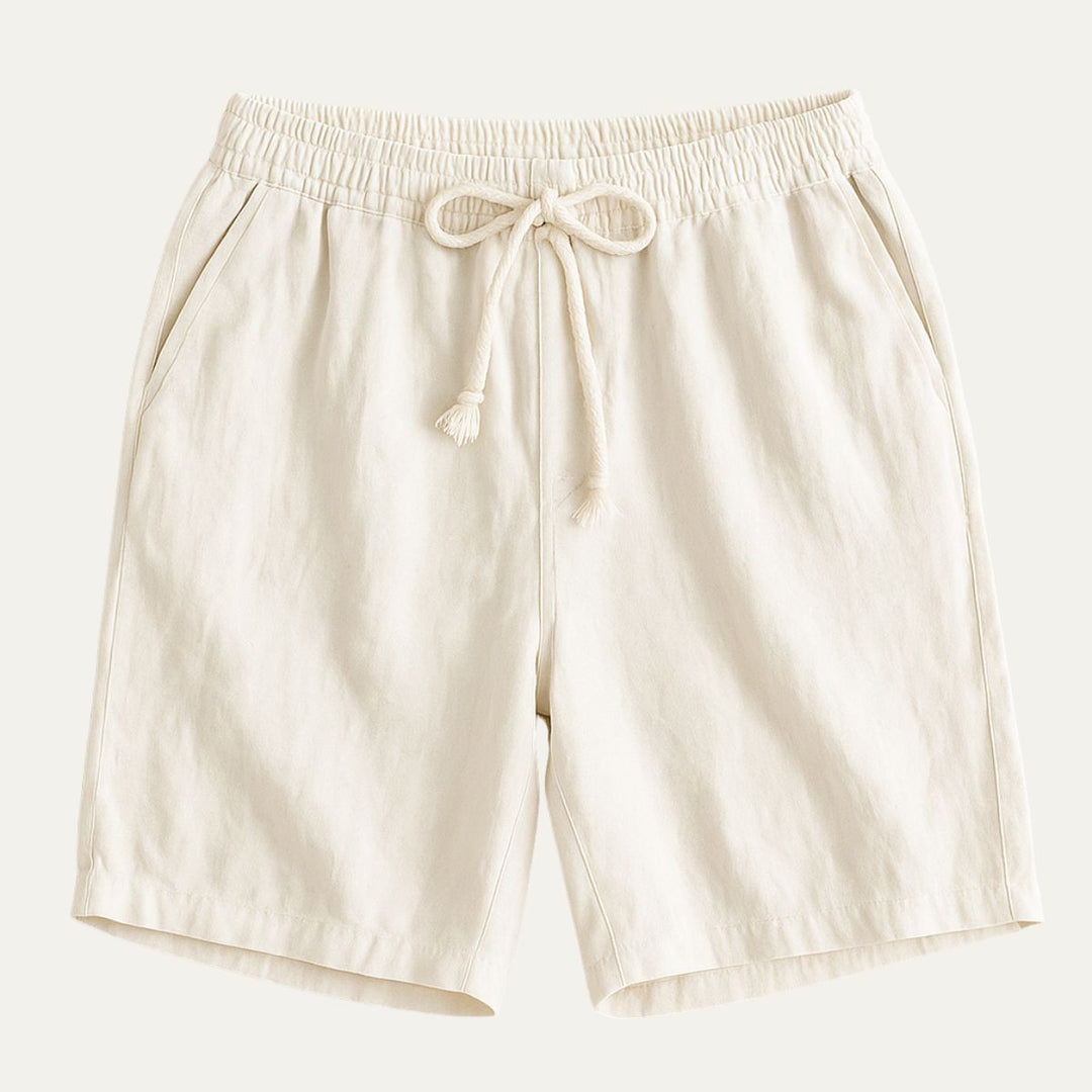 Cream cotton beach shorts with elastic drawstring waist and side pockets