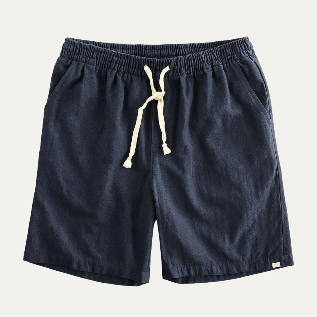Navy men's linen shorts with elastic waist, drawstring tie, and side pockets