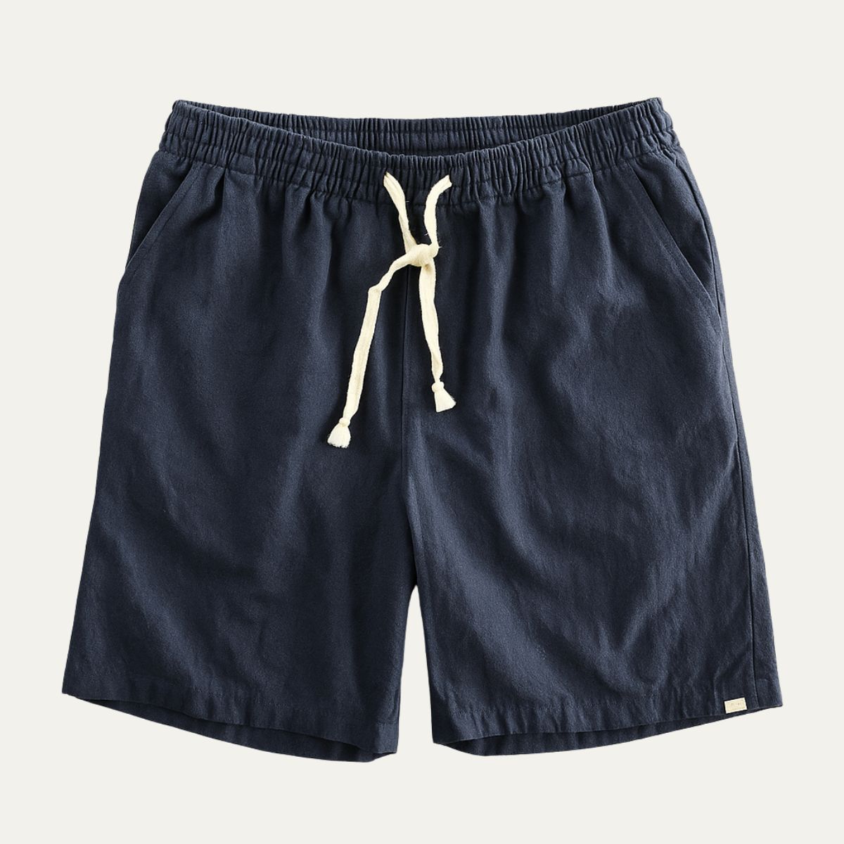 Navy men's linen shorts with elastic waist, drawstring tie, and side pockets